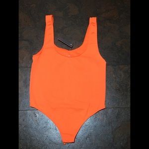 Neon orange body suit